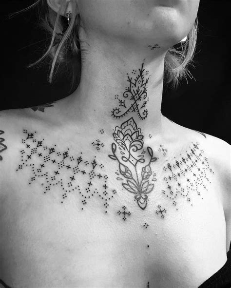 Between chest tattoo female